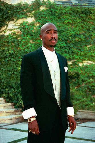 tupac in a business suit.